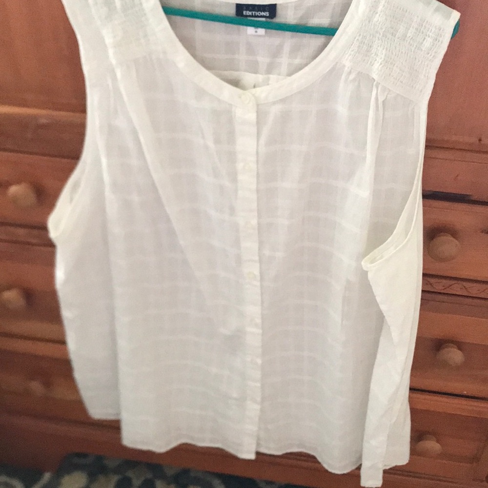 Sleeveless white blouse